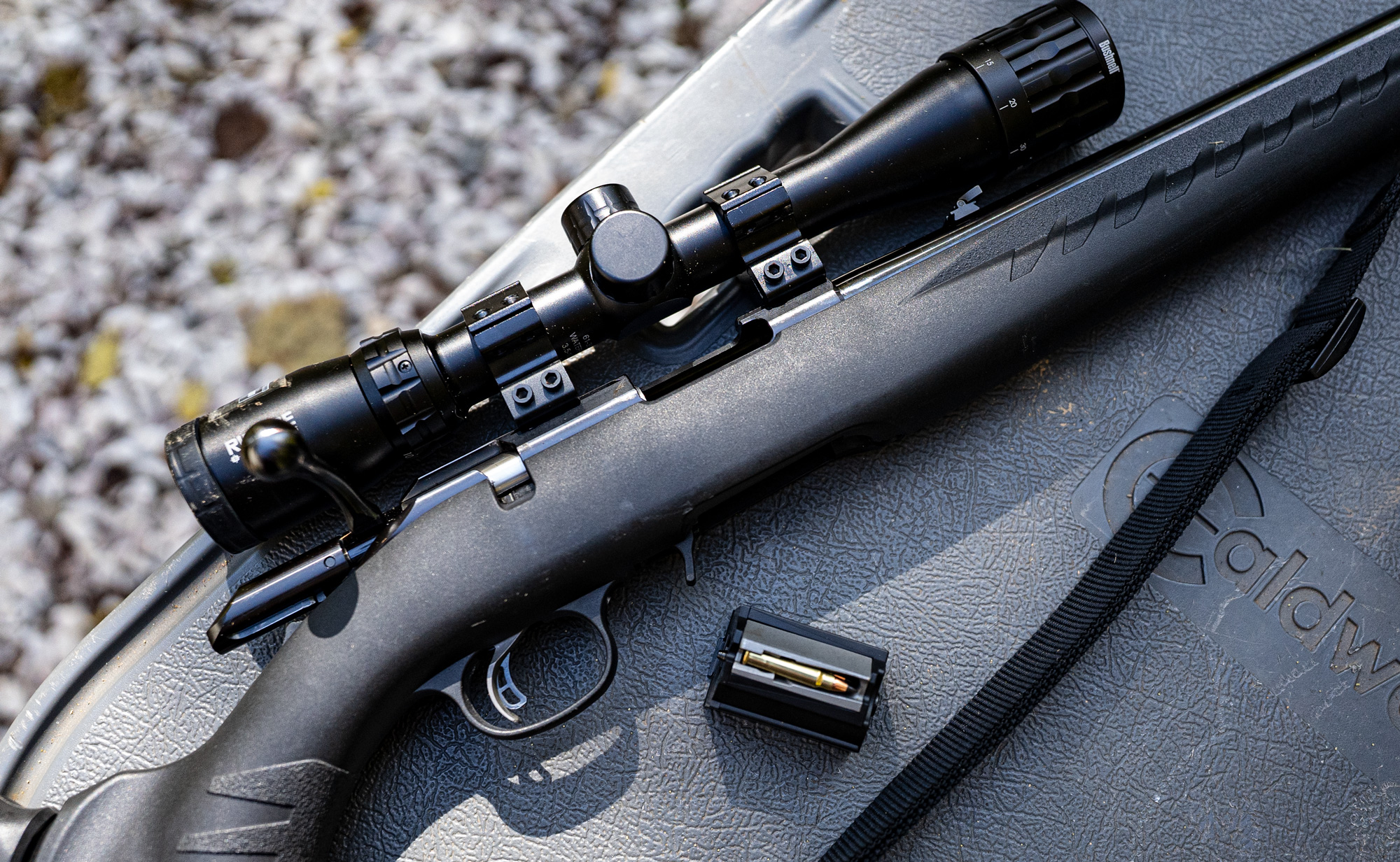 17 HMR rifle and ammo on a shooting bench