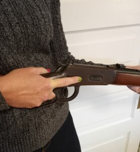 Working the action of a home defense lever action rifle