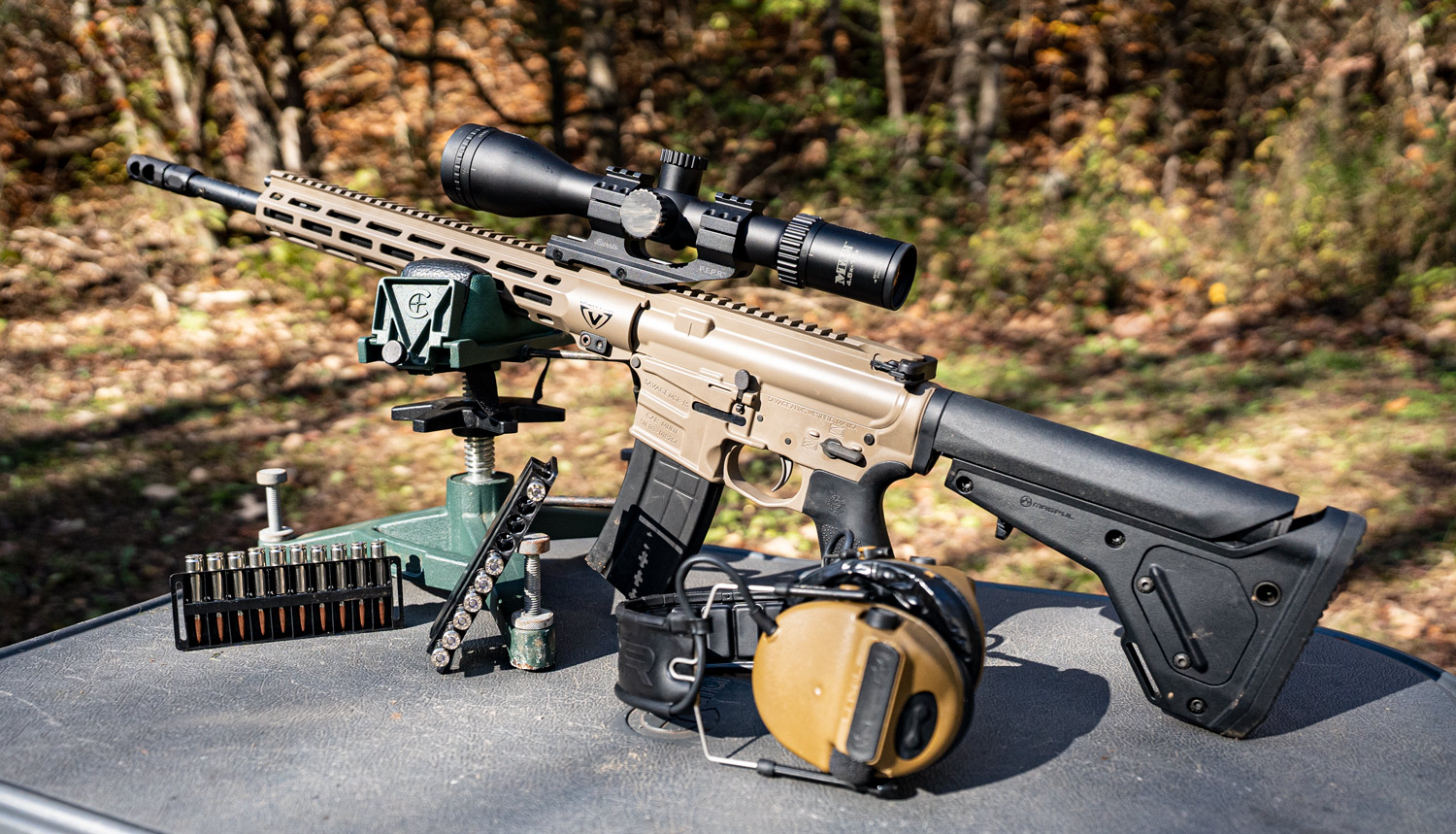 Savage 224 Valkyrie rifle with ammunition on a shooting bench