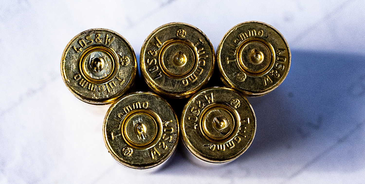 40 SW ammunition headstamps on a table