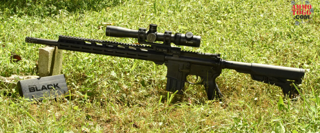 450 bushmaster rifle with ammo at the range