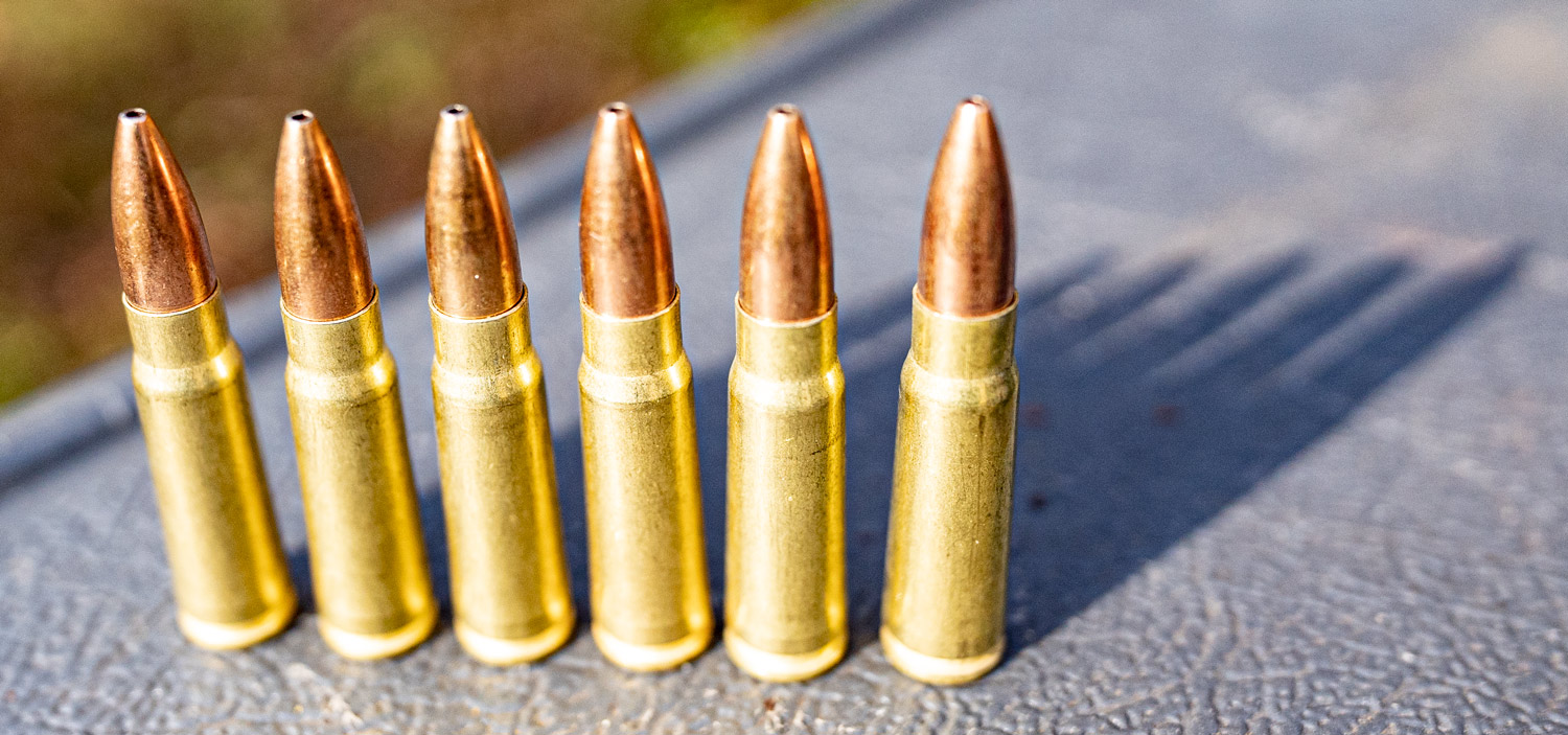 7.62x39 ammo cartridges lined up at a shooting range