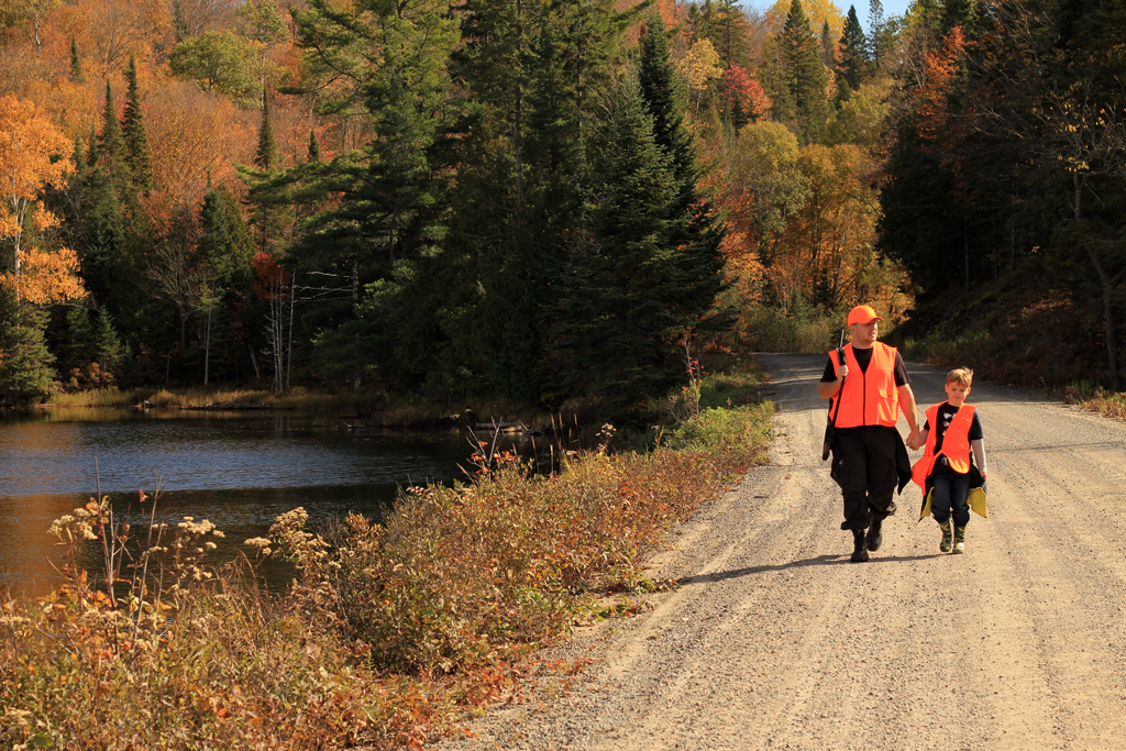 Father and Son Hunting with orange hunting vests