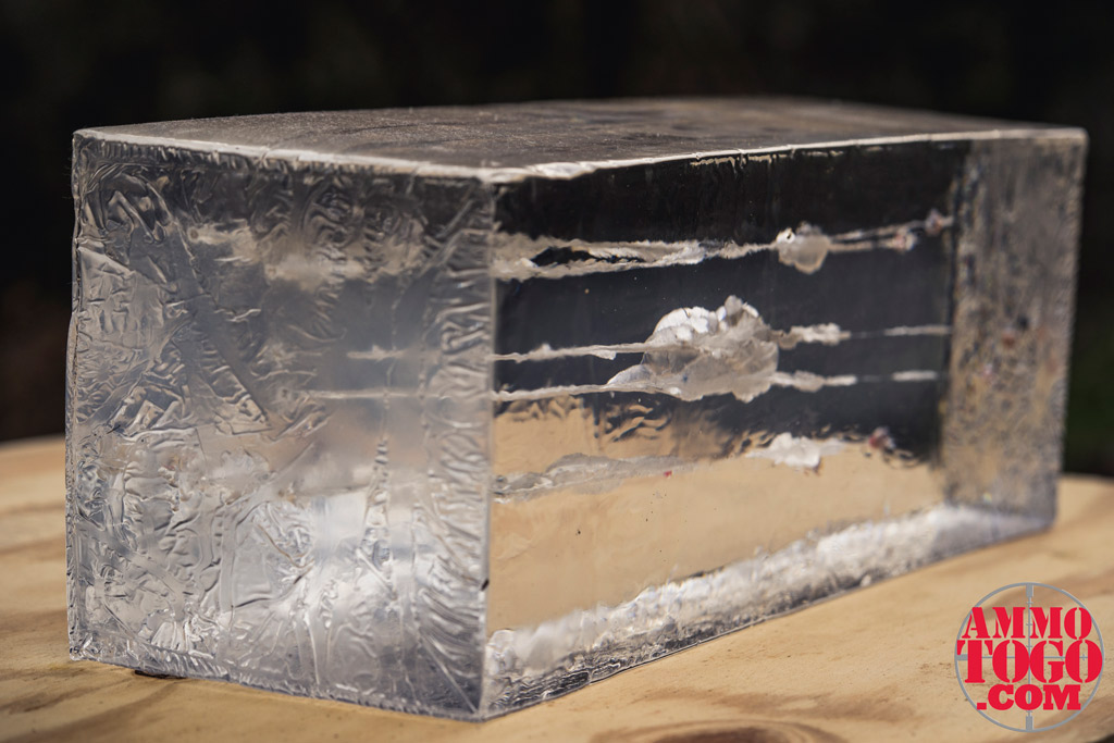 photo of a ballistic gel block on a sheet of plywood