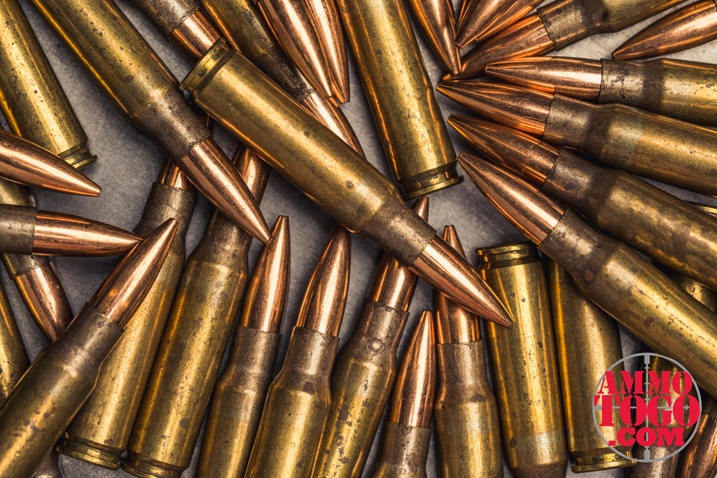 a photo of 308 rifle ammo on top of a steel plate