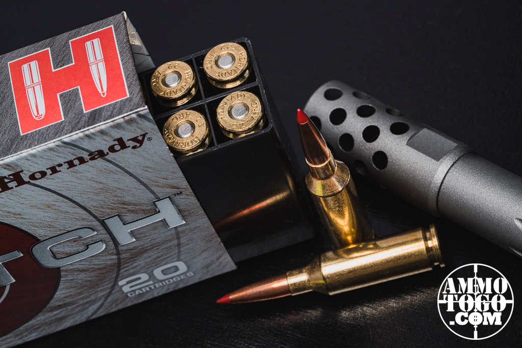 22 ARC ammo and rifle on a table