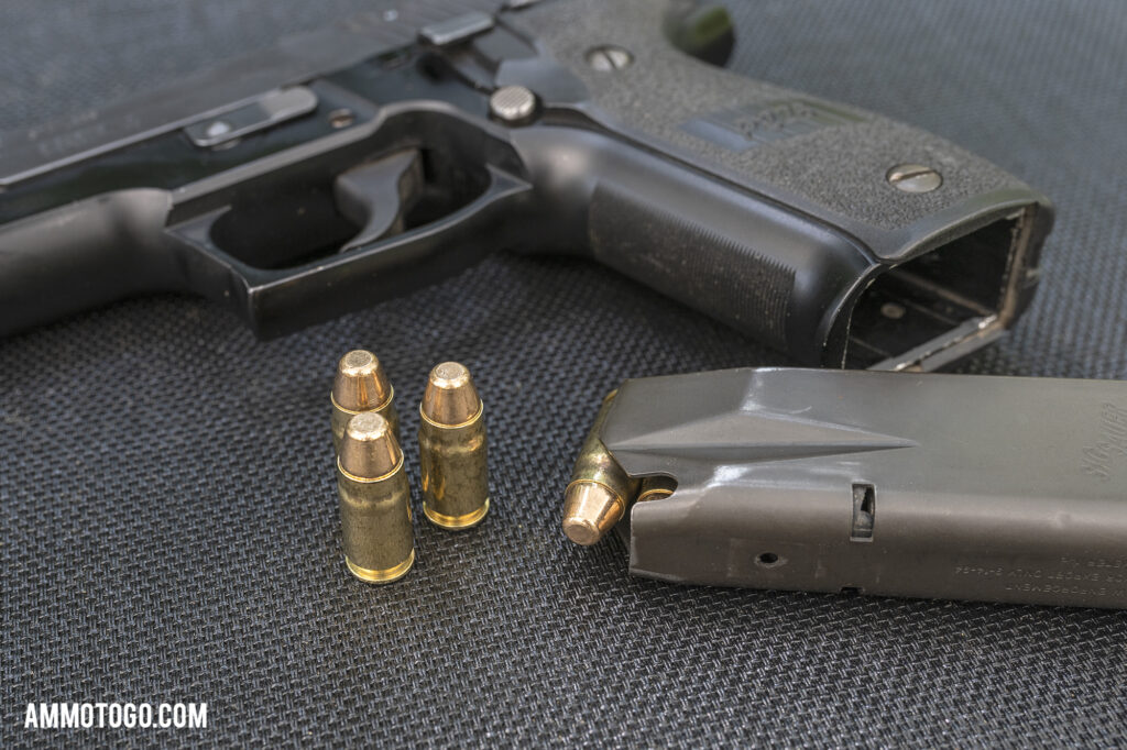 Sig P226 handgun and magazine loaded with 357sig ammunition