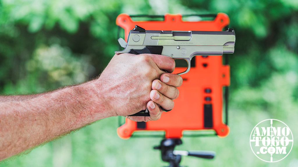 Firing a pistol with a chronograph at the shooting range
