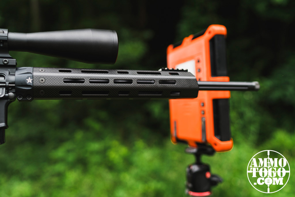 A rifle barrel firing near a chronograph to measure velocity