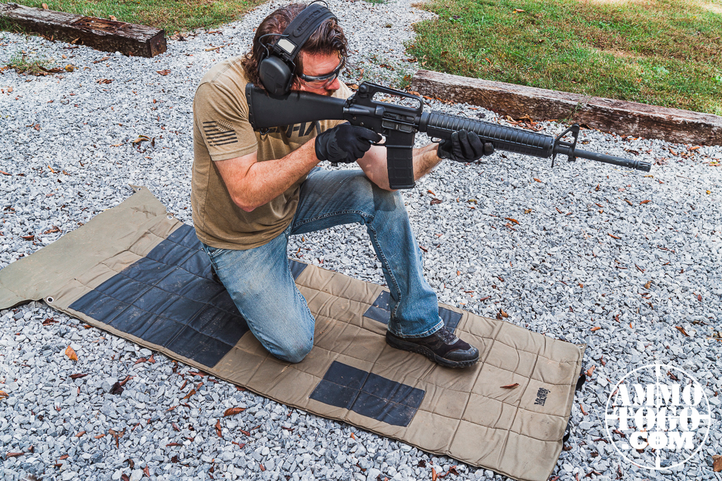 Kneeling shooting position The author demonstrating the kneeling shooting position at an outdoor shooting range