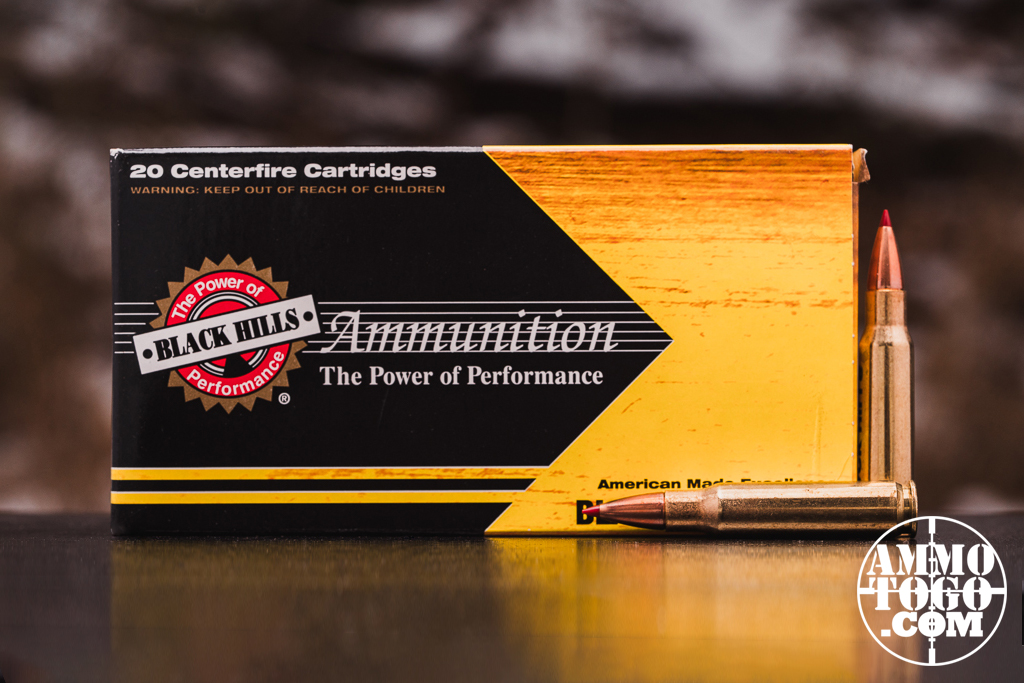 Black Hills Gold 308 ammo displayed on a shooting bench