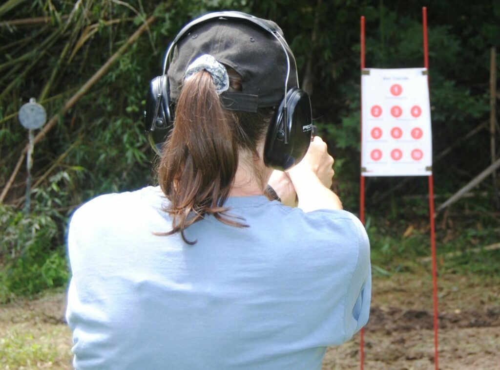 The author shooting a dot torture drill at an outdoor shooting range