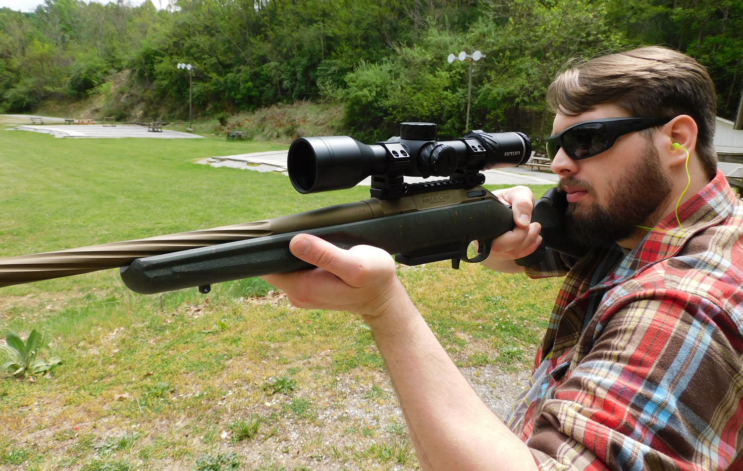 Firing-the-Ruger-Gen-II-Predator-at-the-range The author firing the Ruger American Gen II Predator at a shooting range