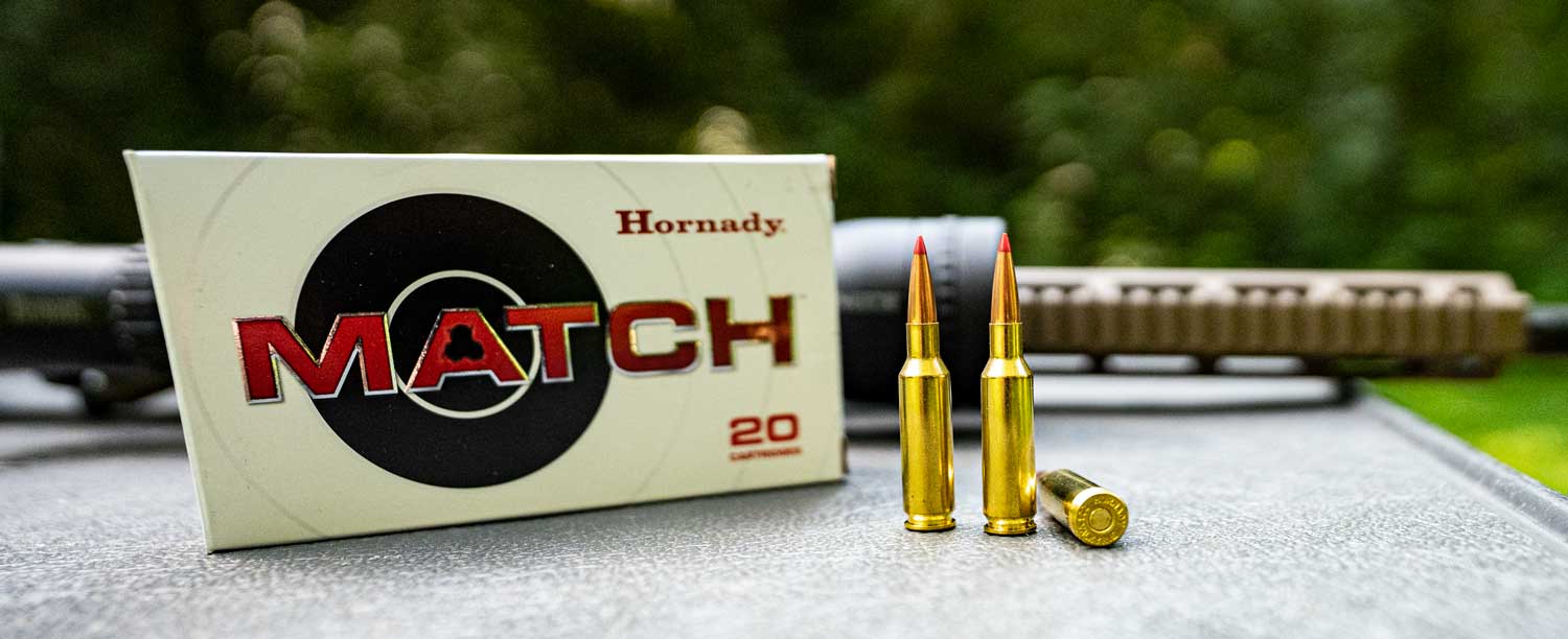 Hornady .224 Valkyrie ammo with a rifle at the range