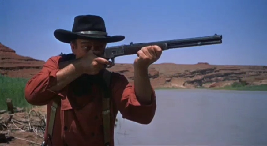 John Wayne with a rifle in the film, The Searchers