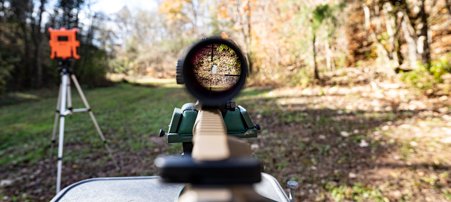 Looking through a rifle scope downrange