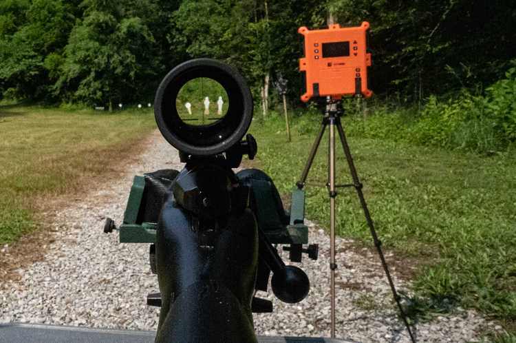Looking down range through the scope of a 243 Win rifle