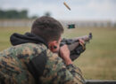 A United States marine firing an M1 garand rifle