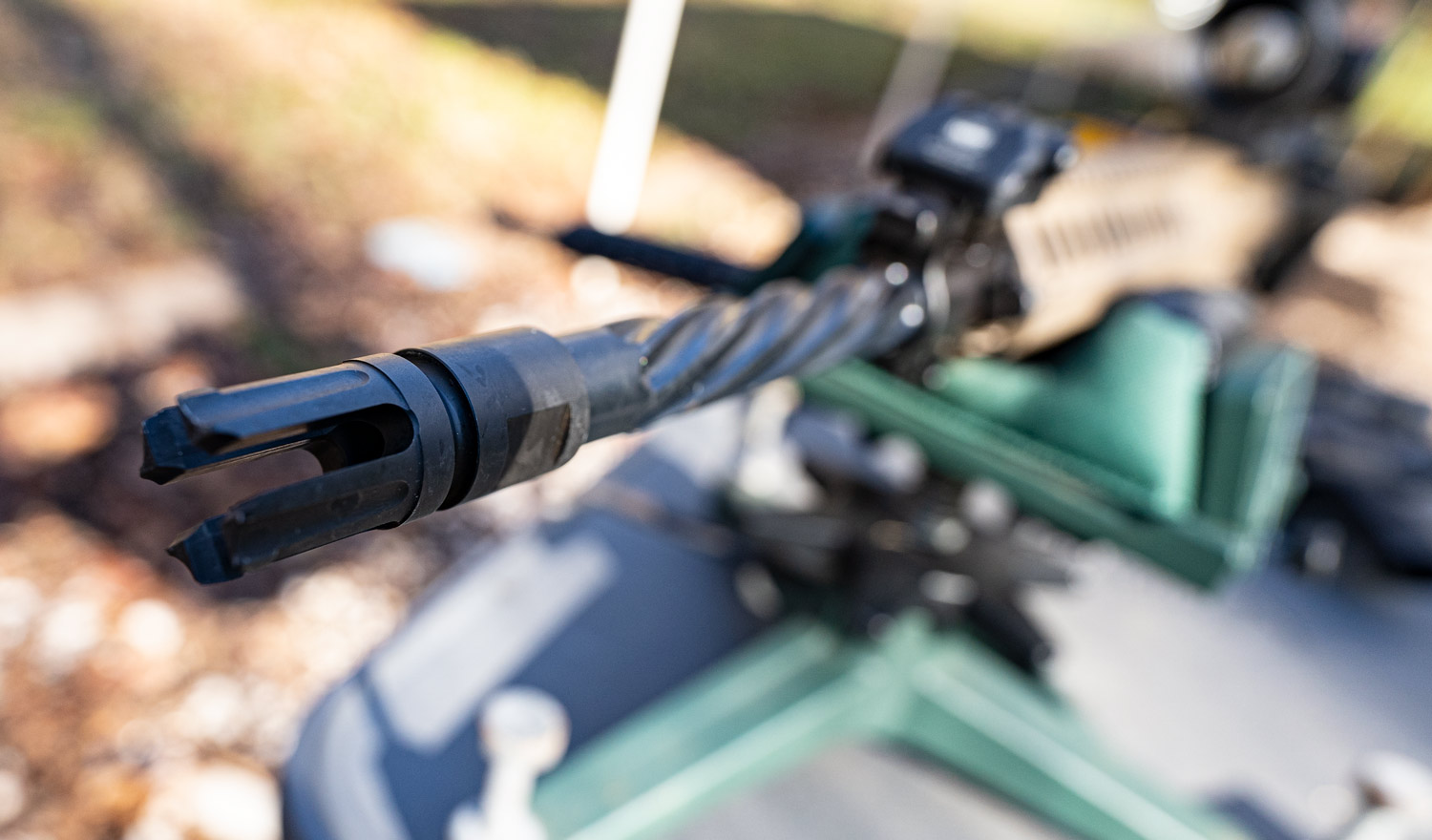 a muzzle brake on an AR-15 rifle in a shooting rest