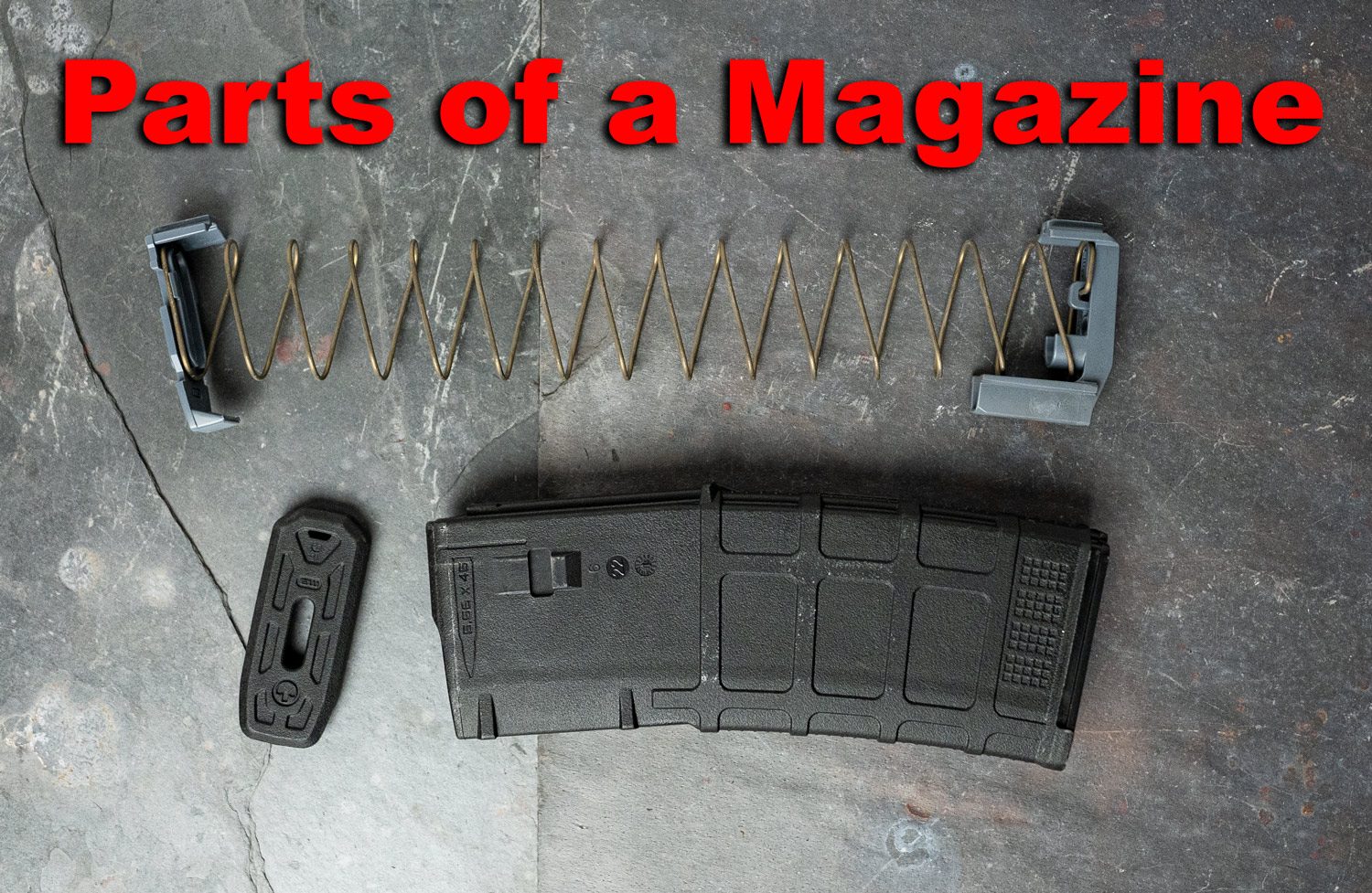 parts of a gun magazine displayed