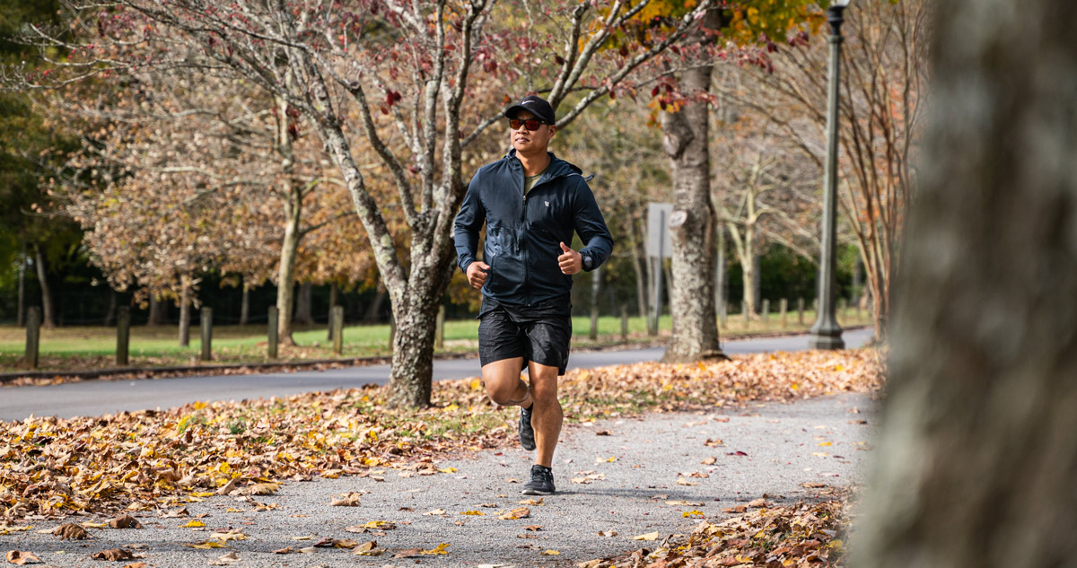 A runner carrying a pistol while they exercise