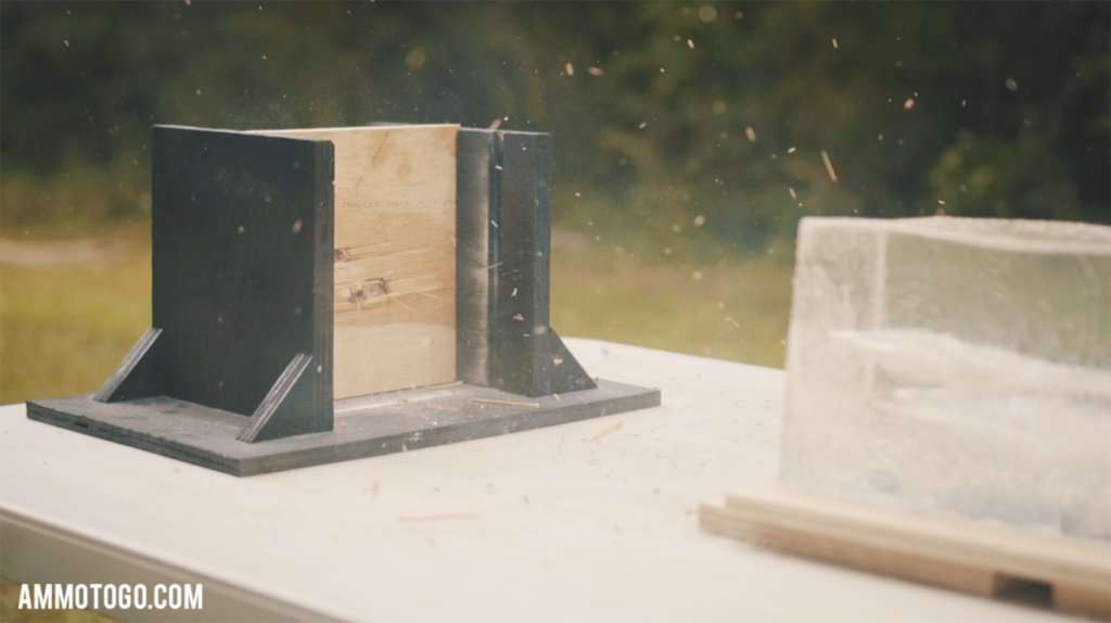 A photo showing ammo being fired through plywood for ballistic testing purposes. 