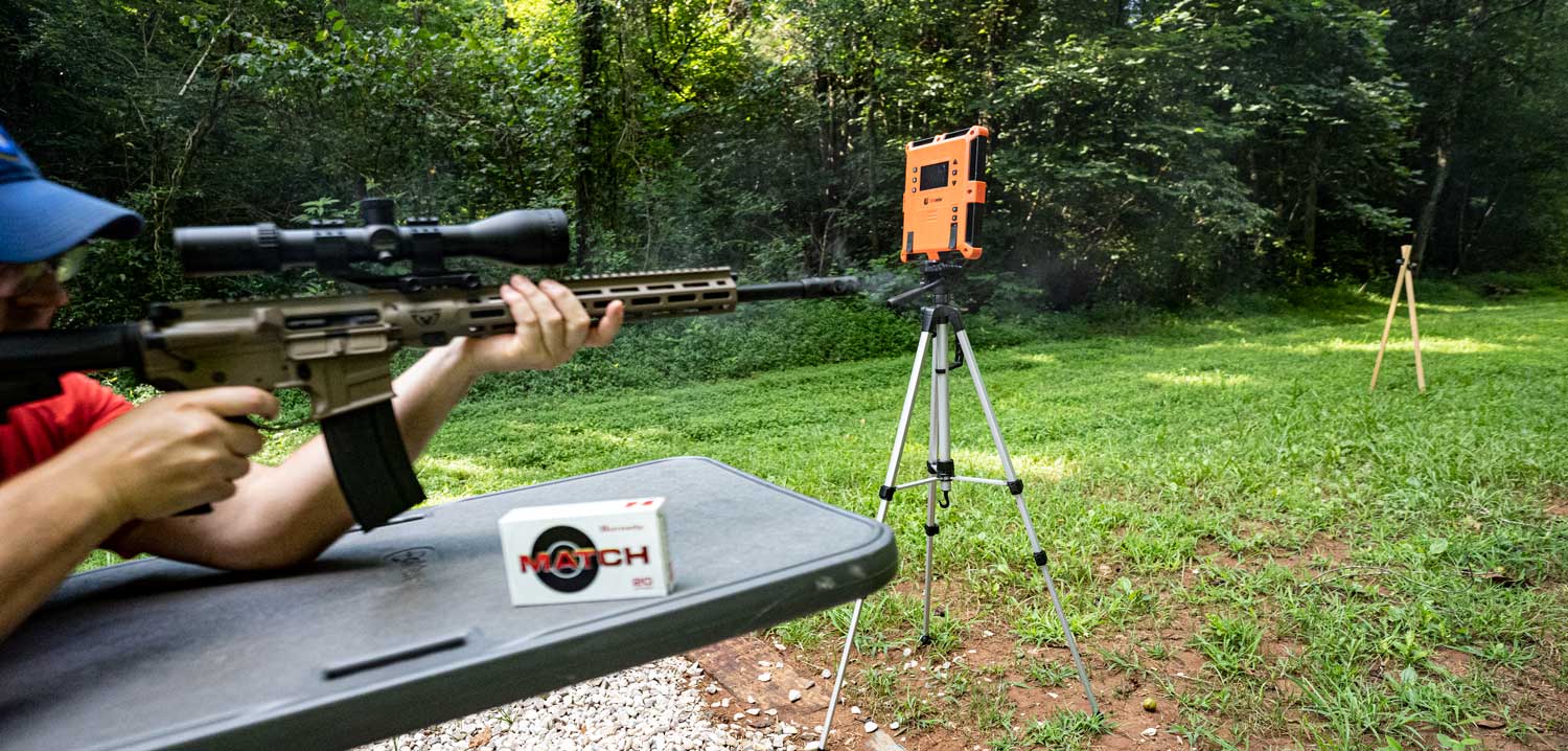 the author shooting a .224 valkyrie carbine at the range