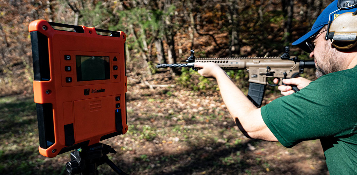 Shooting an AR-15 with a magpul magazine at a shooting range