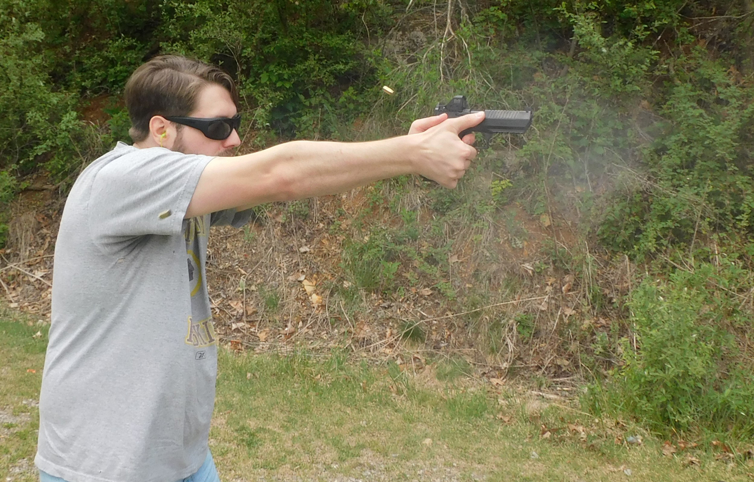 Shooting the IWI Jericho The author firing the IWI Jericho 941 pistol at the range