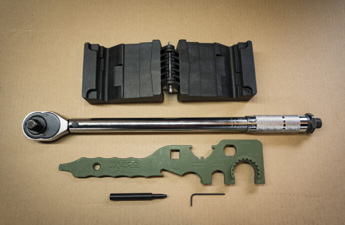 tools laid on a table that you'll need to change an AR-15 barrel