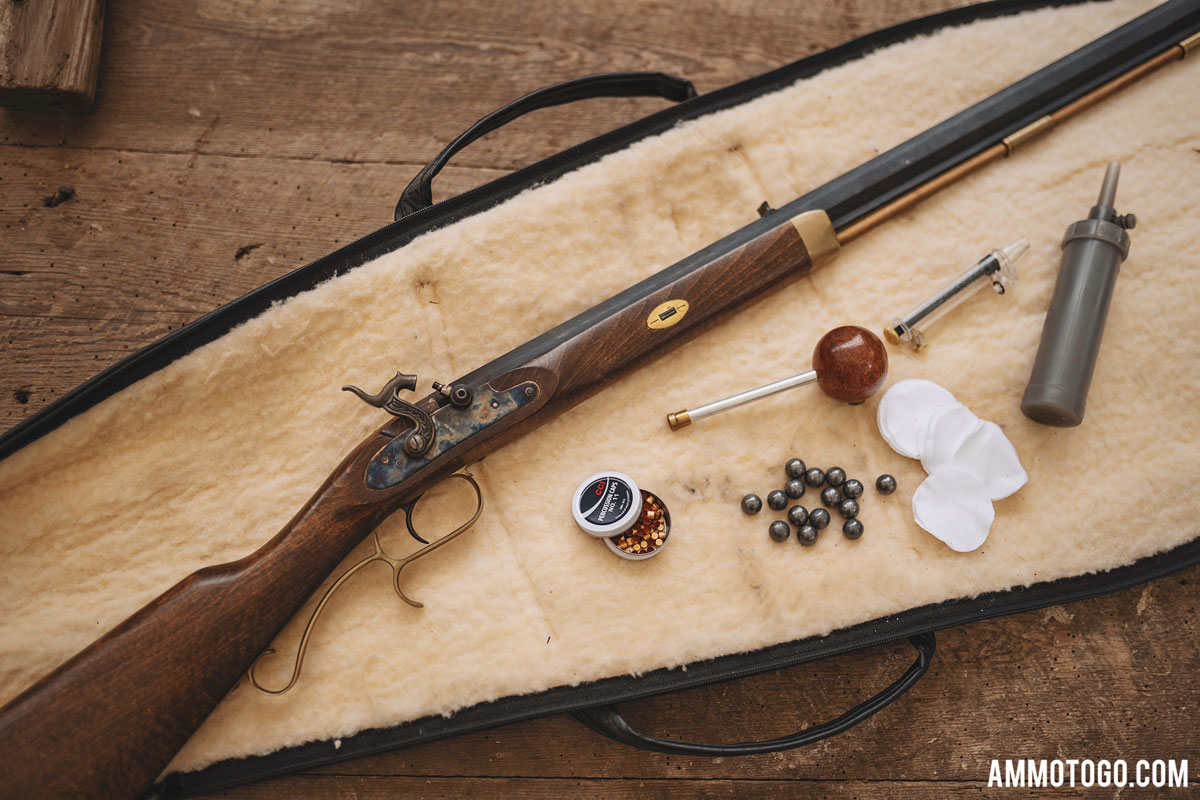 muzzleloader and components on a rifle case