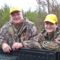 The author's father and her son deer hunting