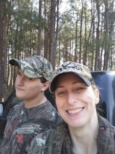 author deer hunting with her son in the woods