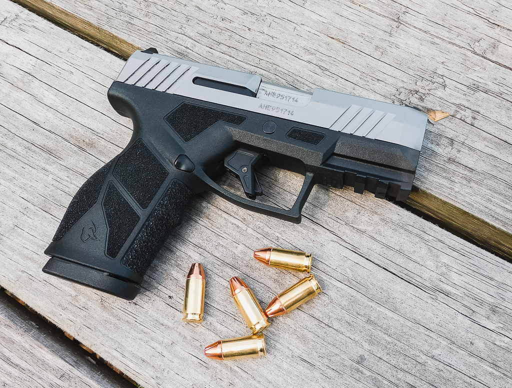Taurus GX2 exposed on a table with ammo