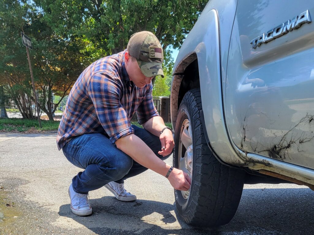 Checking tire pressure while wearing a holster