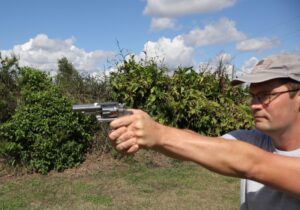 The author firing the Colt Viper revolver at an outdoor shooting range as part of his work in writing this review.